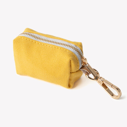 Yellow coin purse with a gold zipper and keychain on a white background
