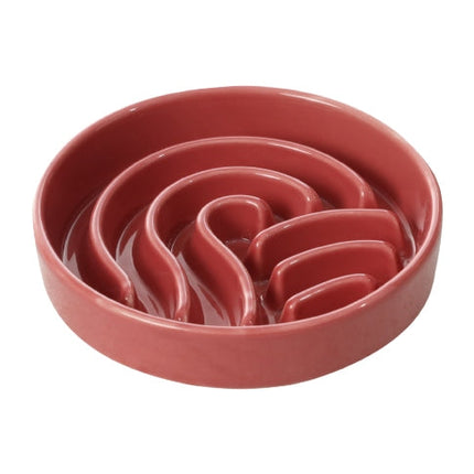 Red ceramic puzzle bowl on a white background