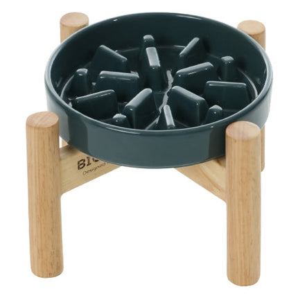Pet food bowl with wooden base and geometric design on a white background