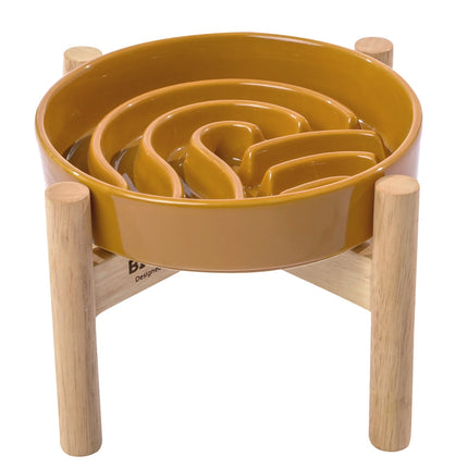 Yellow maze toy with wooden base on a white background