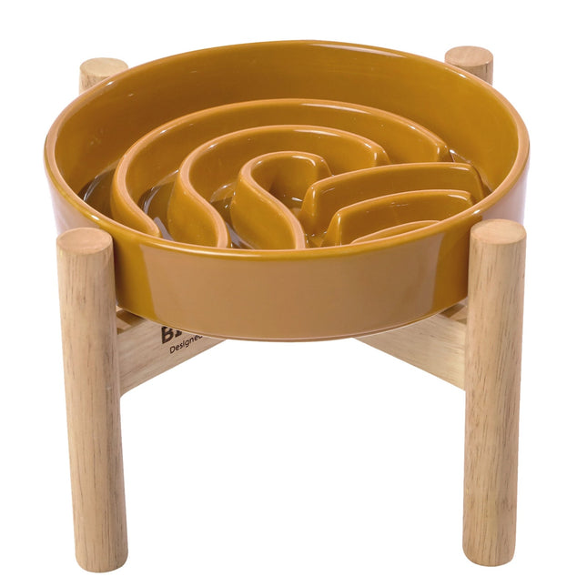 Yellow maze toy with wooden base on a white background
