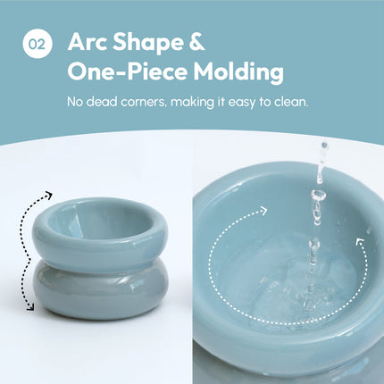 Blue ceramic bowl with arc shape and one-piece molding, shown on a white background.