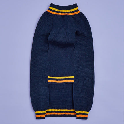 Dark blue sweater with yellow and orange stripes on a light purple background