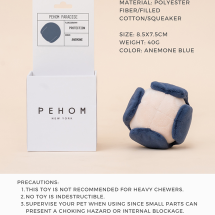 Pet toy with packaging and product details on a beige background