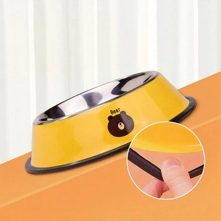 Yellow pet bowl with bear design on a white background
