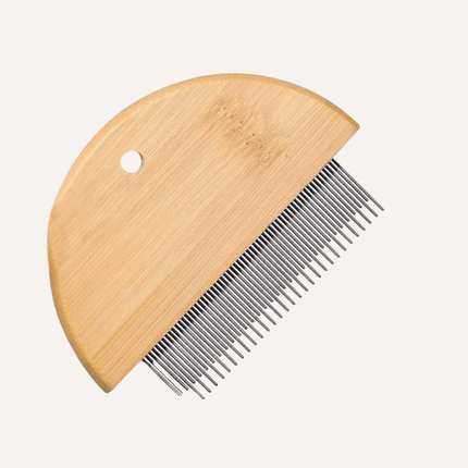 Wooden comb with metal teeth on a white background