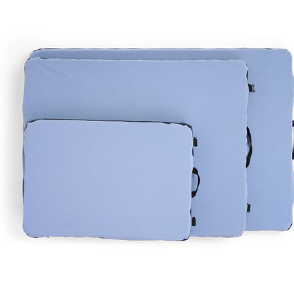Set of light blue pet beds with black on a white background