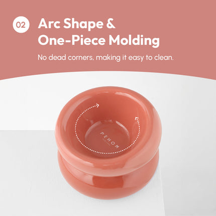 Coral-colored pet bowl with 'Pelow' branding on a white background, featuring text about arc shape and one-piece molding.