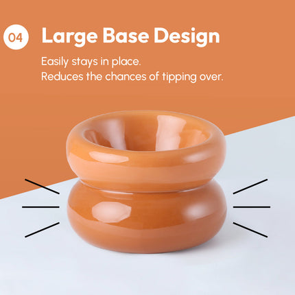 Orange cylindrical object with a large base design on a white and orange background