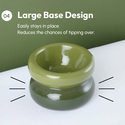 Green bowl with large base design on a white surface with green background