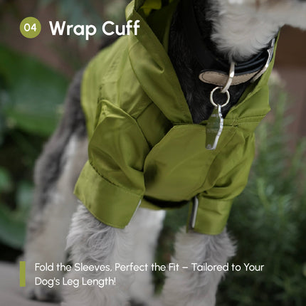 Dog wearing an olive green jacket with wrap cuff feature, standing outdoor