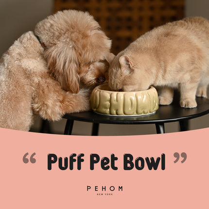 Two pets drinking from a Puff Pet Bowl with 'PEHOM' branding.