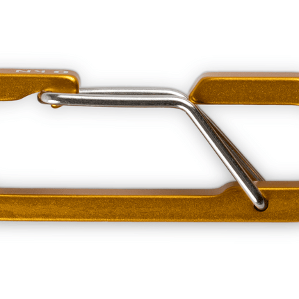 Gold carabiner on a white background