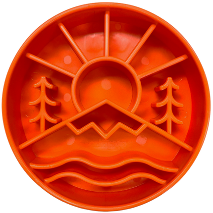 Orange silicone feeding bowl with nature design on a white background