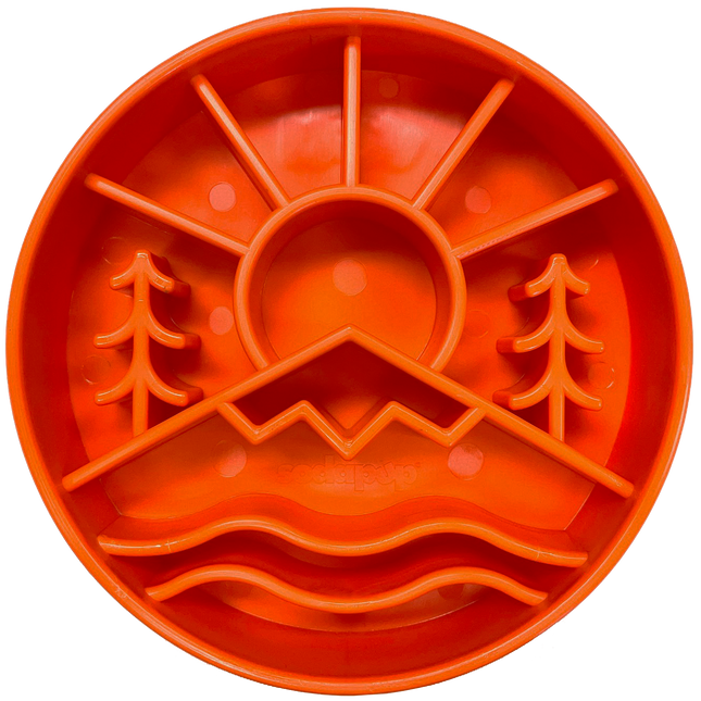 Orange silicone feeding bowl with nature design on a white background