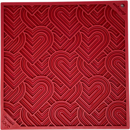 Red textured mat with heart patterns and 'love' text on a red background