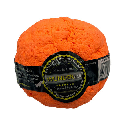 Orange Wunderball with a label on a white background