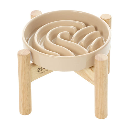 Beige maze toy with wooden base on a white background