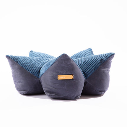 Three blue and gray pet bed with a gold tag on a white background
