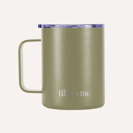 Green insulated mug with purple lid on a white background