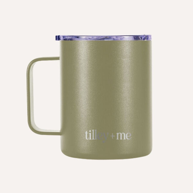 Green insulated mug with purple lid on a white background
