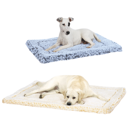 Two dogs lying on different textured pet mats against a white background