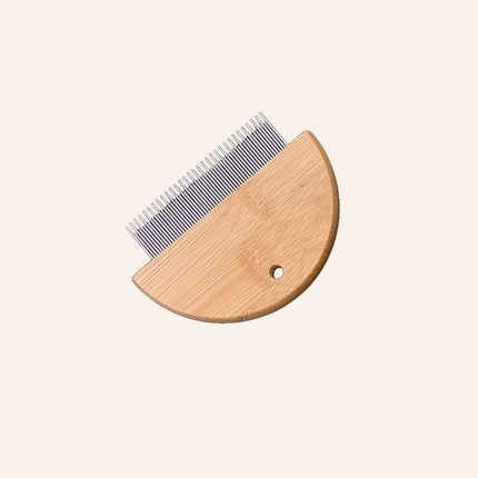 Wooden comb with metal teeth on a white background