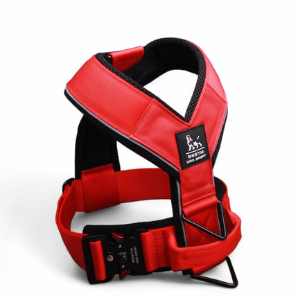 Red dog harness with black accents on a white background