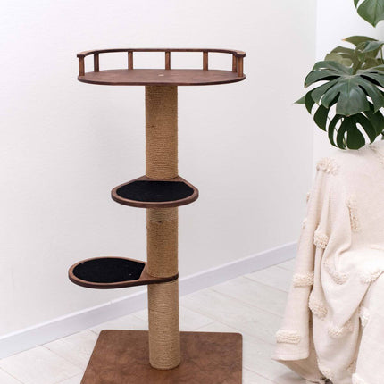 Cat tree with multiple levels and a scratching post in a room with a plant and white furniture.