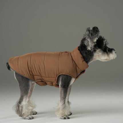 Dog wearing a brown coat on a gray background