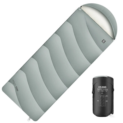 Gray sleeping bag with white interior and black pump on a white background