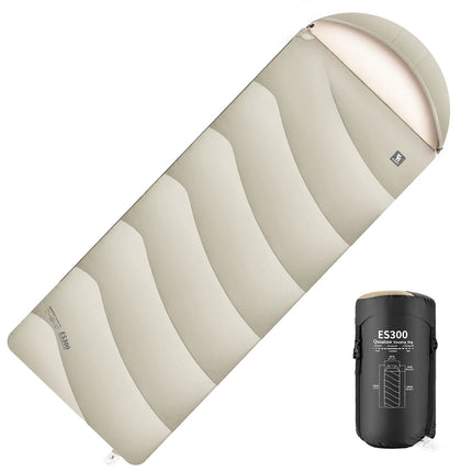 Camping sleeping bag with a black compression sack on a white background