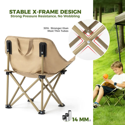 Beige folding chair with stable X-frame design, shown with a child reading in a grassy area.