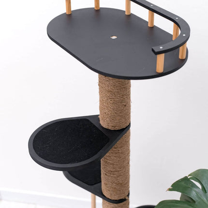 Cat tree with black platforms and a scratching post on a white background
