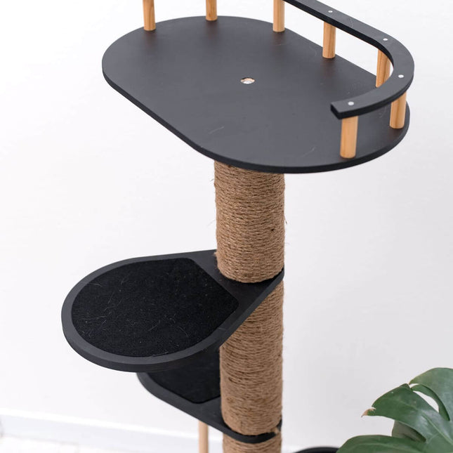 Cat tree with black platforms and a scratching post on a white background